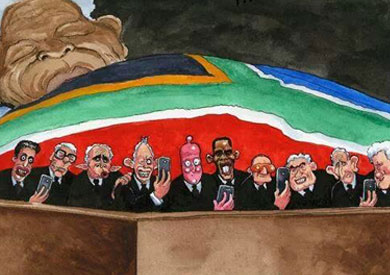 كاريكاتور يسخر من زعماء العالم أثناء تأبين مانديلا